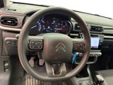 the interior of a car with a steering wheel and dashboard controls