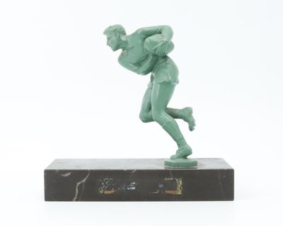 statue of a man holding a baseball bat on a marble base