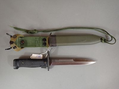 three different types of knives on a white surface