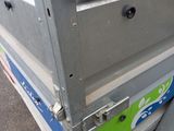 a close up of a metal box on the ground