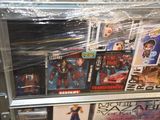 a display case full of action figures in a store