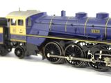 a toy train on a white surface with a white background