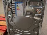 a washing machine that is sitting on the floor