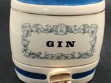 a close up of a white and blue container with a face on it