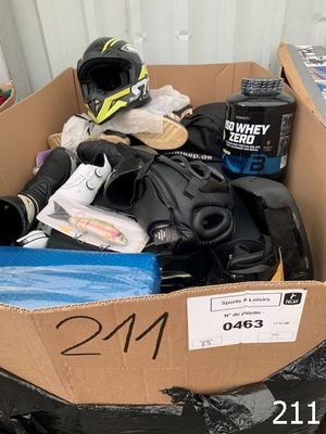 a cardboard box with a helmet, gloves, and other items in it