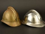 two hard hats sitting next to each other on a table