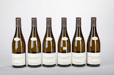 six bottles of wine lined up in a row on a table