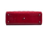 a close up of a red purse on a white background