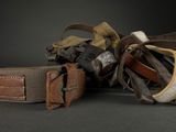 many different types of belts on a black surface