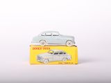 a small toy car sitting on top of a box