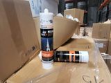a lot of boxes and a can of glue on the floor