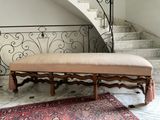 a bench that is sitting in front of a staircase