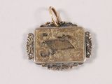 a gold pendant with a picture of a horse on it