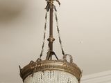 a chandelier hanging from the ceiling in a room