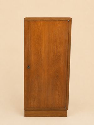 an image of a wooden cabinet with a door