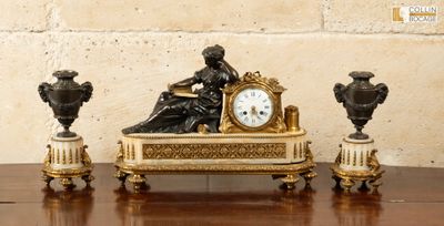 a clock sitting on top of a table next to three vases