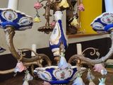 a blue and white chandelier with flowers on it