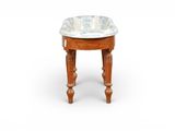 a small wooden table with a blue and white bowl on it