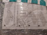 four pieces of paper that are wrapped in plastic
