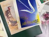 a pile of assorted postcards on a table