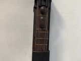 a wooden clock that is hanging on the wall