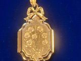 a picture of a gold locke with flowers on it