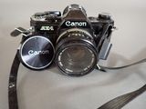 a black camera with a lens attached to it
