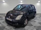 a picture of a small black car parked in a garage