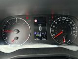 a close up of a car dashboard with a speedometer and gauges