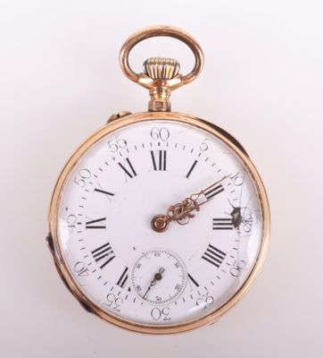 a gold pocket watch with roman numerals on the face