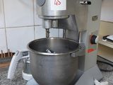 a mixer sitting on a counter in a kitchen