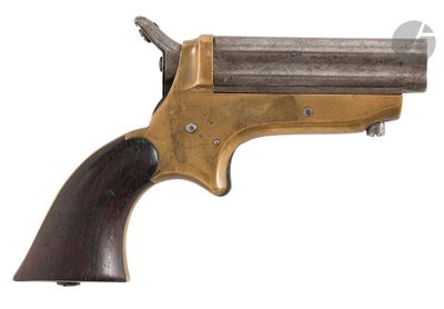 a close up of a gun with a wooden handle on a white background