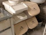 a dirty bathroom with a sink, toilet, and trash can