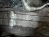 a close up of a car ' s engine with a hose attached