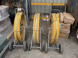 a lot of hoses and carts in a warehouse