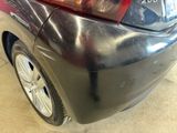 a close up of a car ' s rear bumper