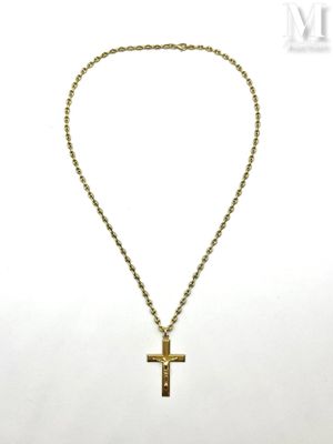 a gold necklace with a cross on a chain on a white background