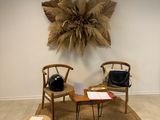 a room with two chairs and a table in it