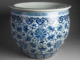 a blue and white vase sitting on a table