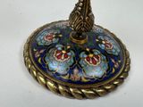 an image of a blue and gold plate with a bird on it