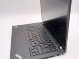 a laptop with a black keyboard on a white surface