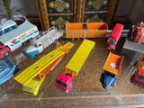 many toy trucks that are sitting on a table