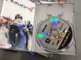 a dvd case with a picture of a motorcycle racing game on it