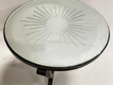an image of a glass table with a starburst design on it