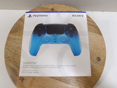a box with a game controller on it on a table