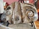a sculpture of a car on display in a museum