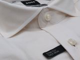 the shirt is white and has a black stripe on the collar