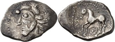 a silver coin with an image of a horse on it