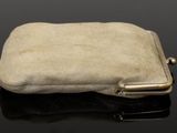 an image of a small purse on a black surface