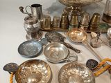 a lot of silver items on the table